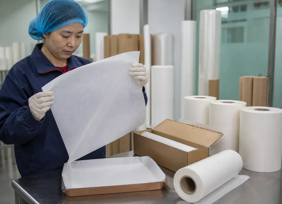 retail rolls, sheets or pre-cut packs of parchment paper inspection and packing